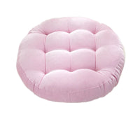 Coussin de sol capitonné rond rose sur fond blanc