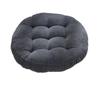 Coussin de sol capitonné noir sur fond blanc