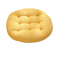 Coussin de sol capitonné rond jaune sur fond blanc