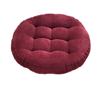 Coussin de sol capitonné rond bordeaux sur fond blanc