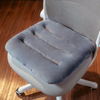 Coussin fauteuil assise classique posé sur un fauteuil de bureau vue de au dessus