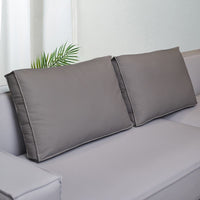 Coussin dossier canapé gris rectangulaire en simili cuir pour canapé sur un canapé avec un mur blanc