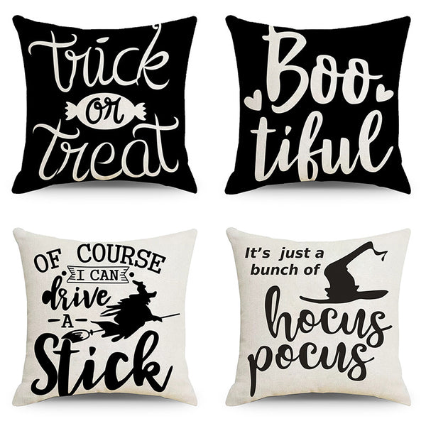 4 coussins 2 noir et 2 blanc avec différent type d'écriture ainsi que différent motifs