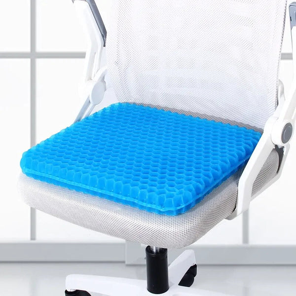 Coussin anti escarre en gel posé sur un fauteuil de bureau
