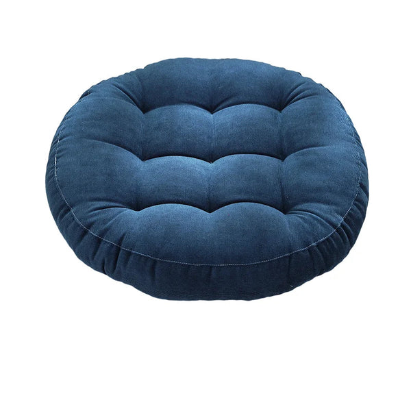 Coussin de sol capitonné rond bleu sur fond blanc