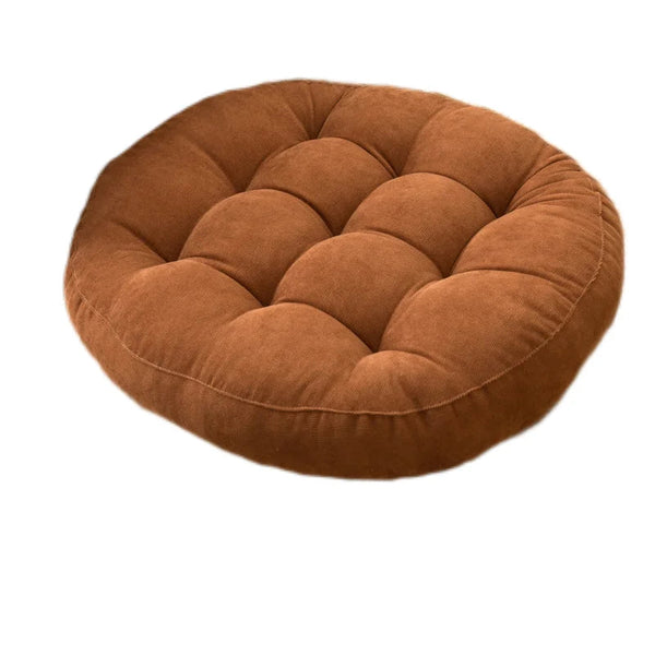 Coussin de sol capitonné marron sur fond blanc